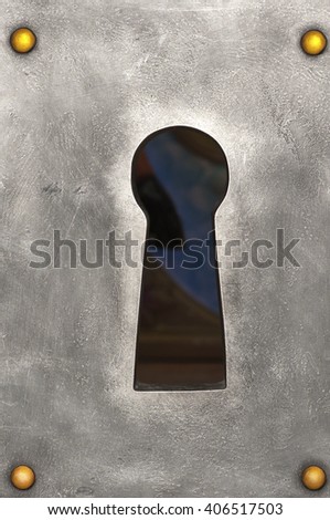 large keyhole in the metal plate with golden nails, closeup