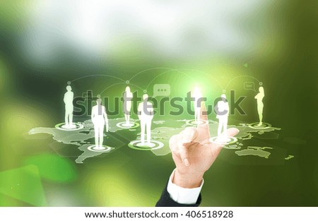 Businesswoman hand touching human silhouette icon on networking system. Abstract green background