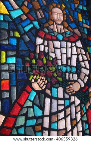 A picture of an image of Jesus made from broken stained glass