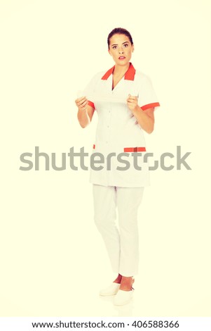 Young female nurse or doctor holding a bandage