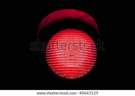 red traffic light, isolated on black background