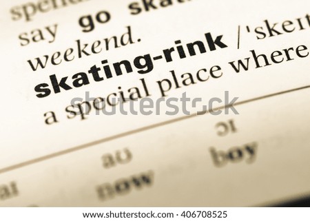 Close up of old English dictionary page with word skating rink