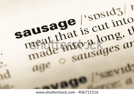 Close up of old English dictionary page with word sausage