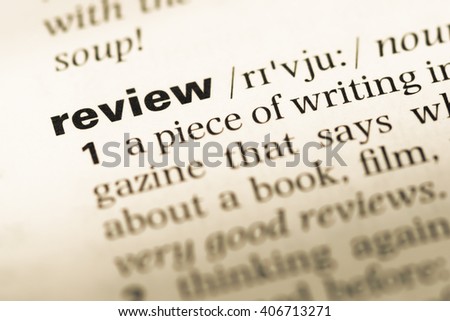 Close up of old English dictionary page with word review Royalty-Free Stock Photo #406713271