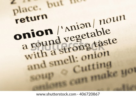 Close up of old English dictionary page with word onion