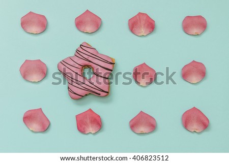 Colorful Donut with Rose Petals in set on Pastel Background. Flat lay. Top view. Minimal concept.
