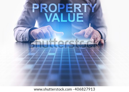 Businessman using tablet pc and select Property value.