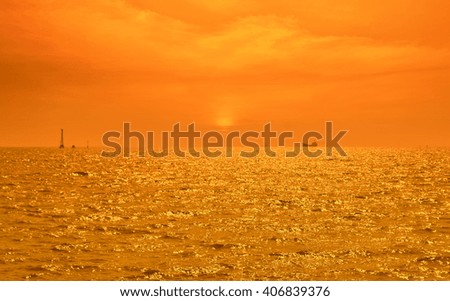 Boat silhouette over sunset sea