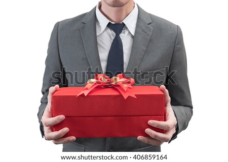 Businessman holding a red gift box  isolated on white background.