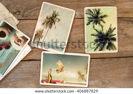 Summer photo album (remembrance and nostalgia) on wood table. instant photo of camera - vintage and retro style