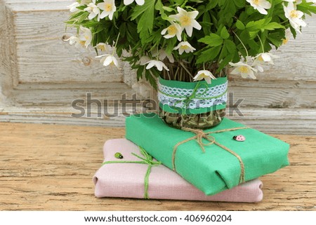 Style if decor: rustic decoration of bouquets and gift boxes with linen cloth and cord