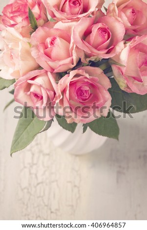 Pink roses in a white vase