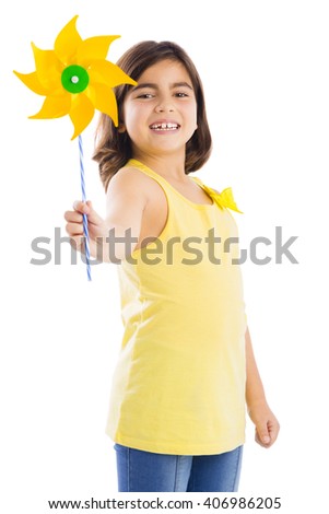 Little girl playing with a toy windmill