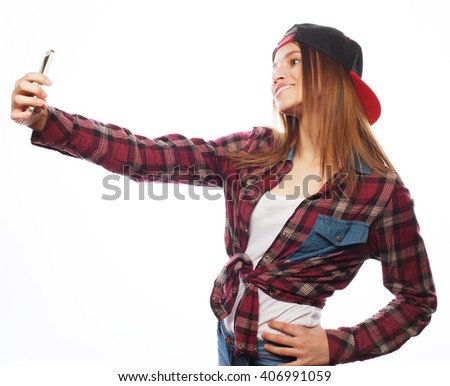 pretty teen girl wearing hat, taking selfies