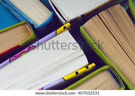 Vintage old books on  light background. Books and reading are essential for self improvement, gaining knowledge and success in our careers, business and personal lives.