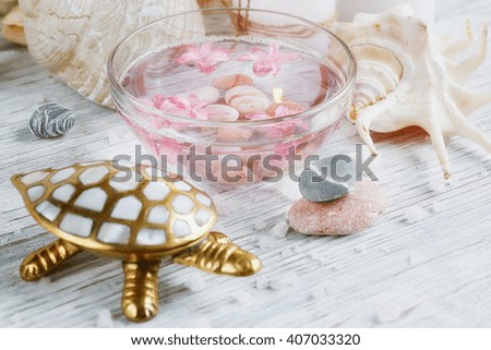 Composition of spa treatment with salt on wooden background