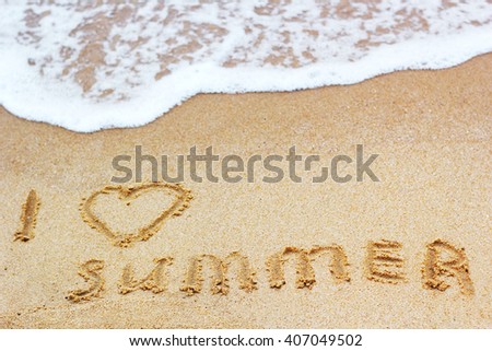 Inscription on wet sand I Love Summer. Concept photo of summer vacation.