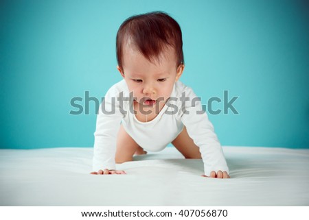 Baby with diaper learn to crawl on the bed crawling is one of the first major steps child, Baby healthy and family concept