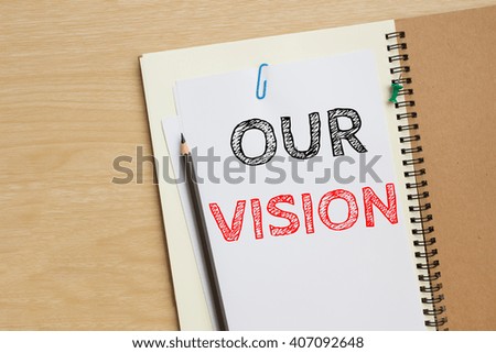 Text our vision on white paper and pencil / business concept