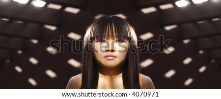 Asian Techno Punk Cyber Woman shrouded by  Patterned Sonic Light Beams.
