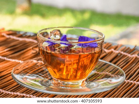 Closeup of cup of tea with flower blur background style