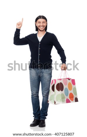 Young man holding plastic bags isolated on white