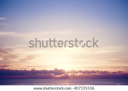 Sunset sky over tropical sea. Vintage filter Royalty-Free Stock Photo #407135536