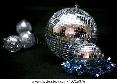 Photo of several disco balls on a black background