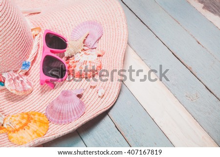 pastel vintage summer background with beach accessories and seashell on vintage blue and white background