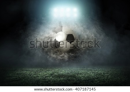 Soccer player with ball in action outdoors Royalty-Free Stock Photo #407187145