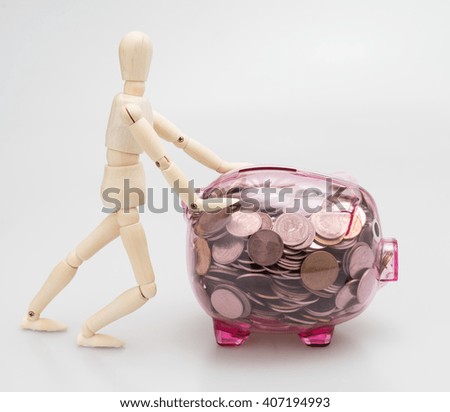 A see through piggy bank pink with money coins / man Wood Figure