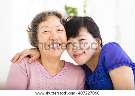 happy senior mother and adult daughter