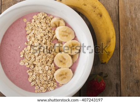 Healthy muesli breakfast with yoghurt, muesli, strawberries and banana