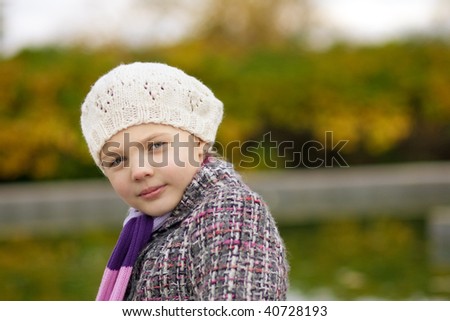 close-up portrait of young pretty small girl with head turned backwards and pretty smile