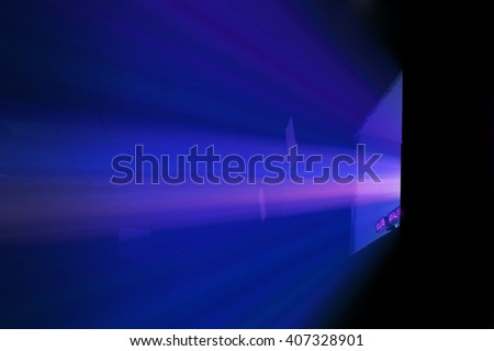 blue projector ray in dark cinema showing room