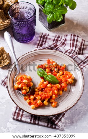 Chickpeas cooked with vegetable sauce. Selective focus.