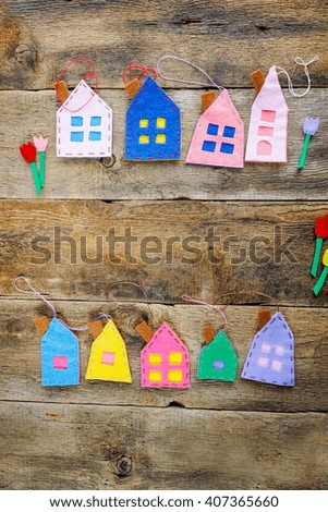 Spring background with houses over wooden background