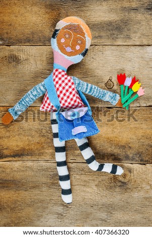 Spring background with baby toys over wooden background