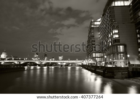 London nights from the piers with Canary Wharf view. Black and white photography