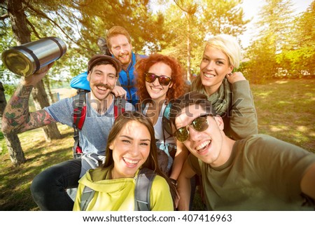 Group of hikers takes photo in nature