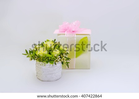 Flowers and a gift on a white background