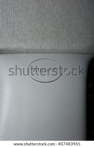 image of the airbag device logo on the plastic part of an internal car