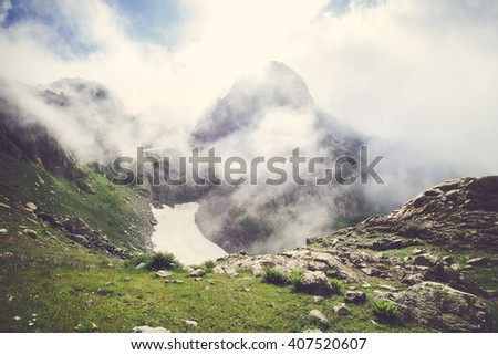 Rocky Mountains foggy Landscape with clouds and green valley Summer Travel serene scenic view