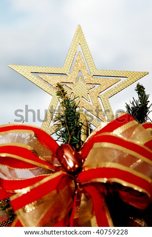 Gold star on top of a Christmas tree