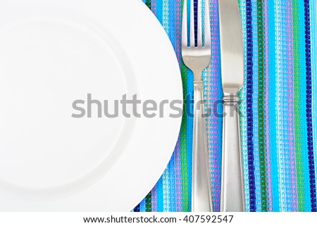 White Plate on a Checkered Tablecloth with Place for Your Text Studio Photo