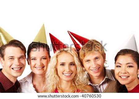 Line of cheerful friends looking at camera with smiles on white background