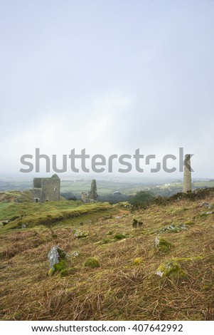 Cornwall's Industrial Heritage, the rugged beauty of Bodmin Moor and the ruins of Holman's Engine house at South Caradon Mine with a distant early morning mist, Cornwall, England, United Kingdom