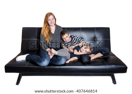 Mama with kids at the sofa isolated on white background