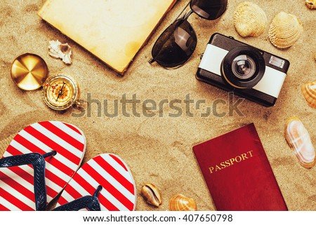 Summer vacation accessories on tropical sandy ocean beach, holidays abroad - summertime lifestyle objects in flat lay top view arrangement