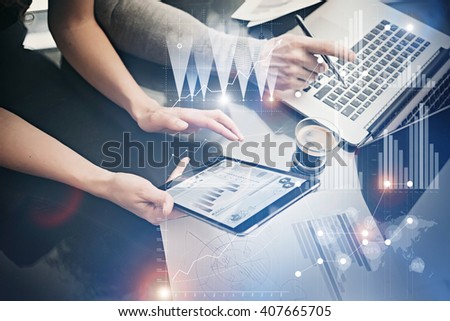 Photo female hands holding modern tablet. Risk managers working new private banking project in office. Using electronic devices. Graphics icons, worldwide stock exchanges interface. Horizontal Royalty-Free Stock Photo #407665705